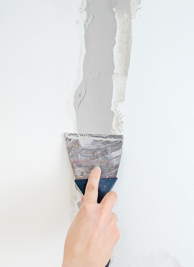 hand repairing wall